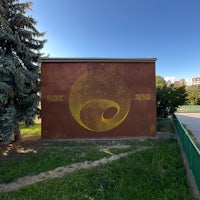 a yellow wall with a yellow circle painted on it