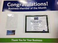a certificate is displayed in a display case