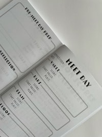 a notebook with the words meet day written on it