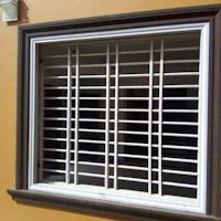 a picture of a window with a metal grille