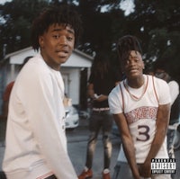 two young men standing next to each other