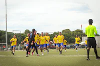 a group of men playing soccer on a field