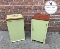 two green cabinets next to a brick wall