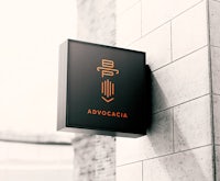 a sign with the word avocaca hanging on the side of a building