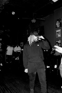 a group of people dancing in a dark room