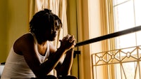 a man sitting in front of a window
