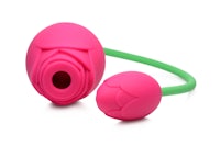 a pink and green sex toy with a pink flower on it