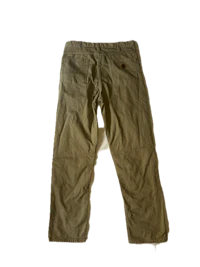 a pair of khaki pants on a black background
