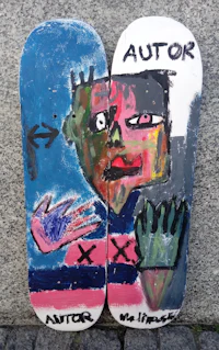 a pair of skateboards with the words'actor' painted on them