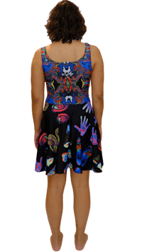 the back view of a woman wearing a colorful dress