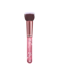 a pink makeup brush on a black background