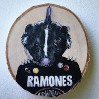a wooden plaque with the words ramones on it