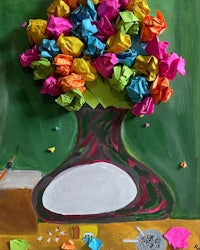 a painting of a vase with colorful paper in it
