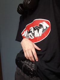 a person wearing headphones and a t - shirt