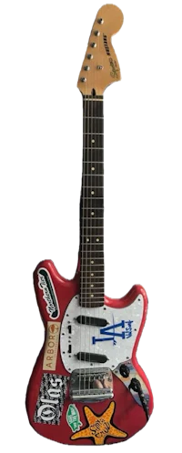 a red guitar with stickers on it
