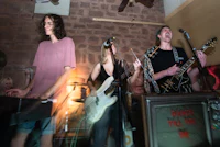 a group of people playing music in a room