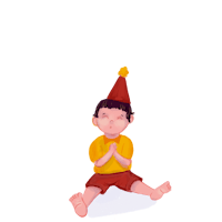 a boy wearing a birthday hat sitting on the floor