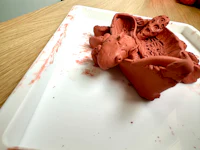 a tray of red clay on a table