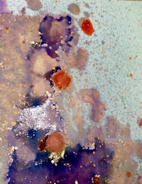 a piece of paper with paint splatters on it