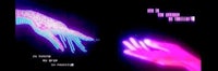 an image of a hand with a pink light on it