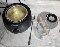 a bowl of ice cream with a spoon sitting on a counter