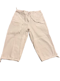 a pair of white cargo shorts on a black background