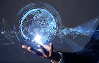 a businessman's hand with a globe in it