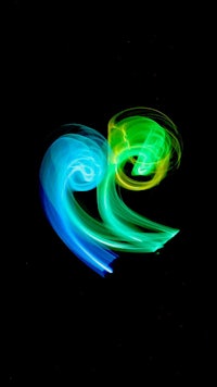 a blue and green swirl on a black background