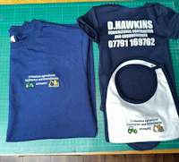 two t - shirts and a bib with the name d hawkins