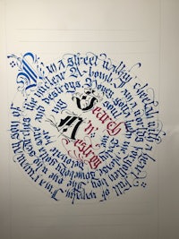 a piece of calligraphy on a piece of paper