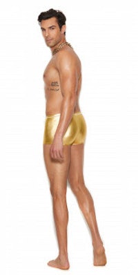 a man in gold shorts posing on a white background