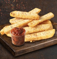a tray of french fries with dipping sauce