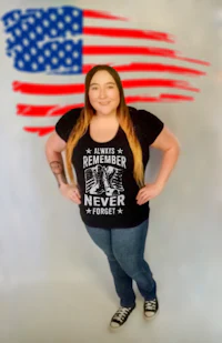 a woman posing in front of an american flag