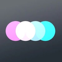 a pink, blue, and white circle on a dark background