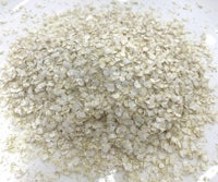 oats in a white bowl on a table