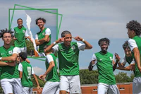 a group of soccer players on a field