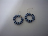 a pair of blue and white striped hoop earrings