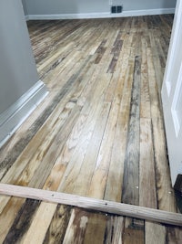 a room with wood floors and a door