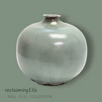 a green vase on a green background
