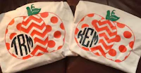 two t - shirts with monogrammed pumpkins on them