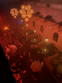 a group of people sitting in a dark room