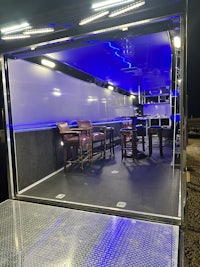the inside of an enclosed trailer with blue lights