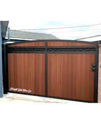 a wooden gate with a black and brown design