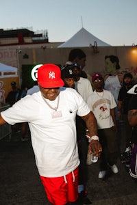 a man wearing a red hat and red shorts