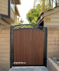 a wooden gate in front of a house in california