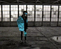 a person standing in an abandoned building with a blue piece of paper
