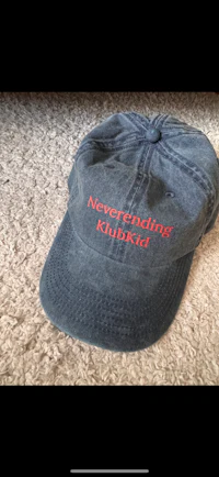 a baseball cap with the word'neverending chicken'embroidered on it
