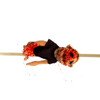 a stuffed animal lying on a pole with blood on it