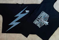 two black t - shirts with lightning bolts on them