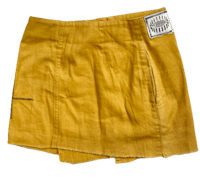 a yellow linen skirt with a label on it